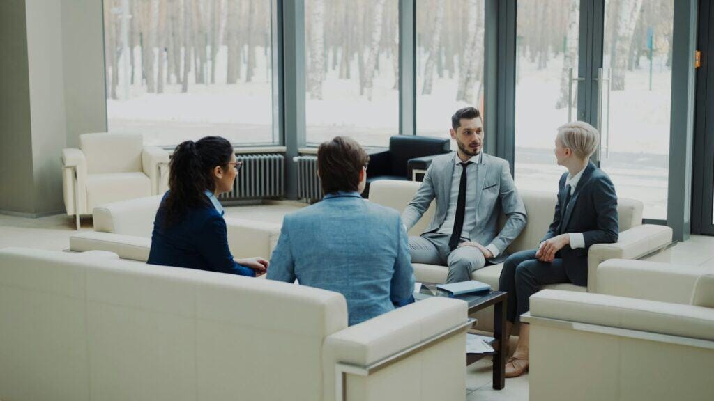 Group of business professionals meeting in a modern corporate office